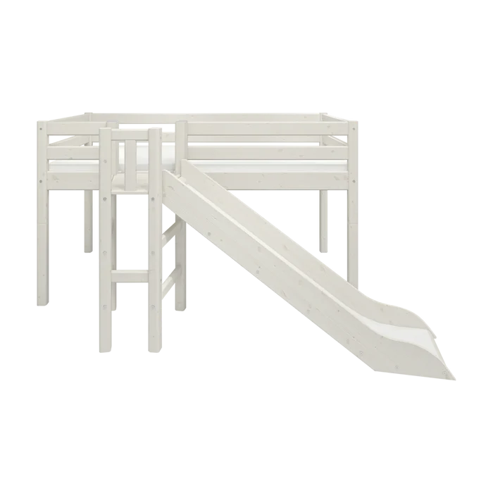 FLEXA loft bed from WHITE collection in solid pine with dividing safety rail, ladder and slide, shown in child’s bedroom.