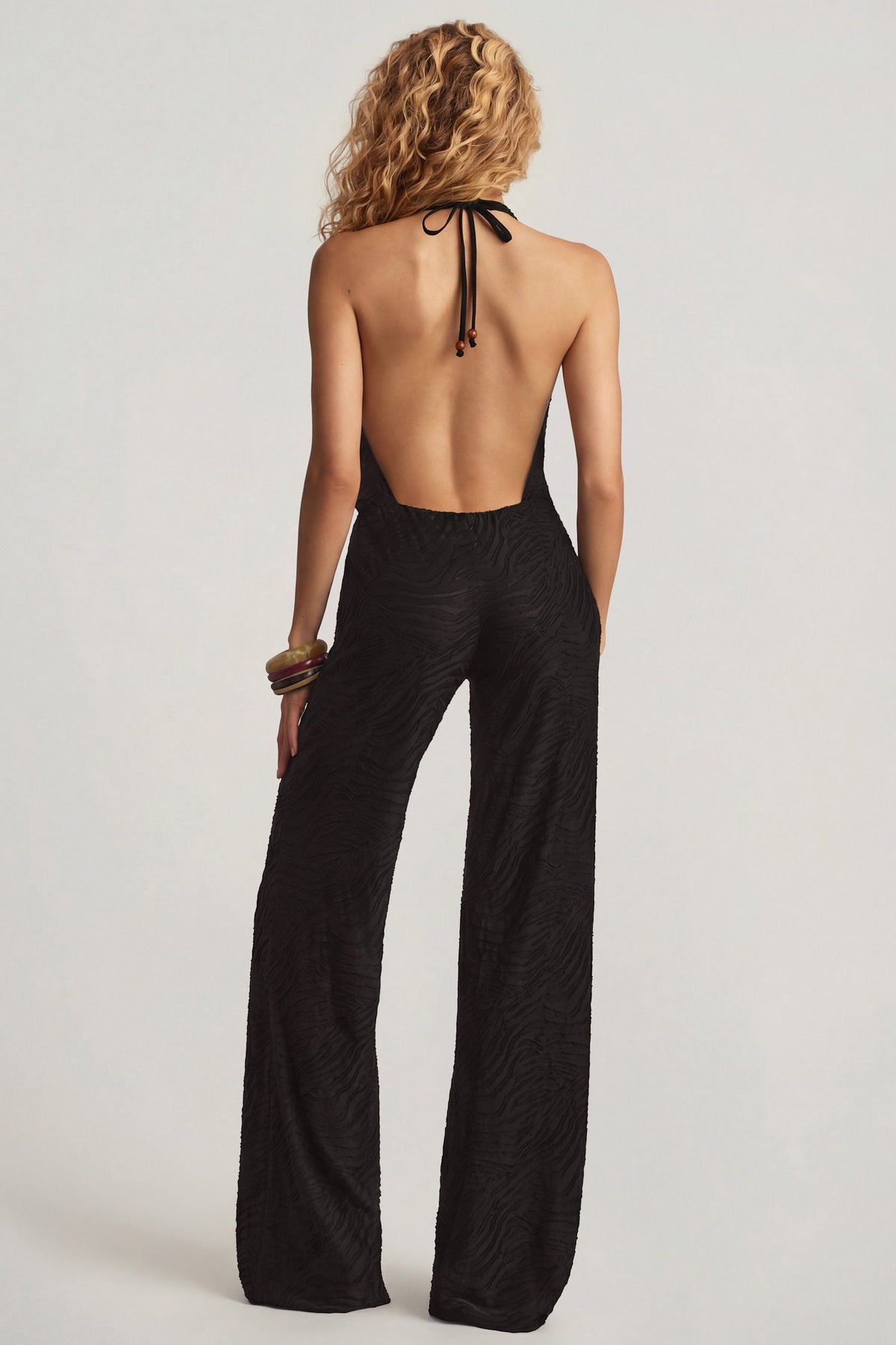 Devoré Halterneck Open-Back Jumpsuit in Black