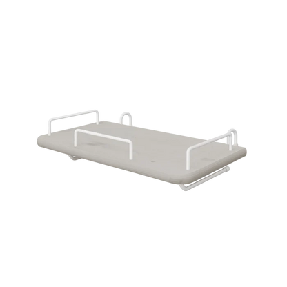 FLEXA bedside tray from the GREY collection, grey MDF with four white metal handles, child-safe edges, by a bed.