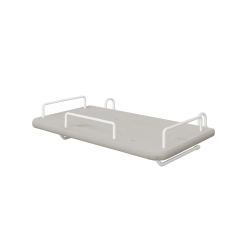 FLEXA bedside tray from the GREY collection, grey MDF with four white metal handles, child-safe edges, by a bed.