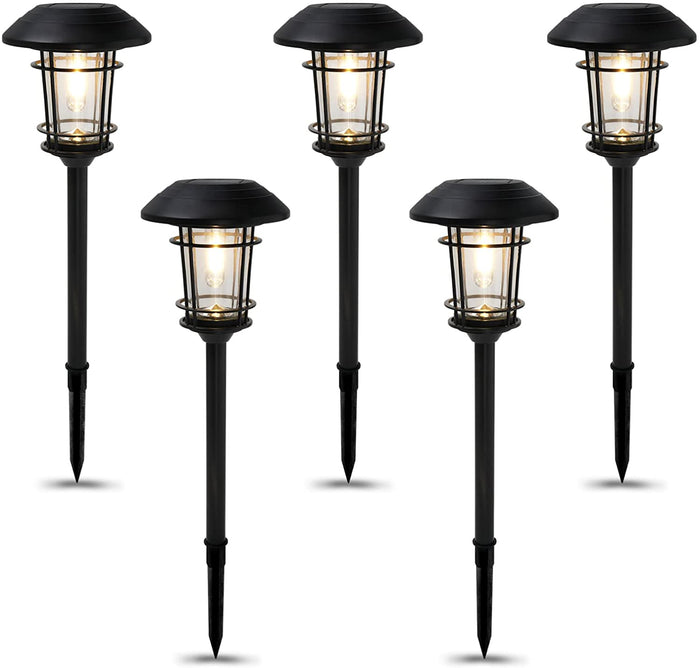 Set of five black outdoor solar path lights on a white background
