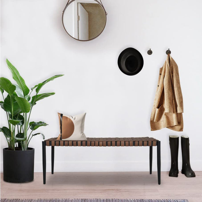 Grand Patio 2-seat bench with a steel frame and leather-look resin wicker, placed in a modern entryway setting.