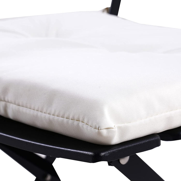 Close-up of a white cushion on a black metal frame