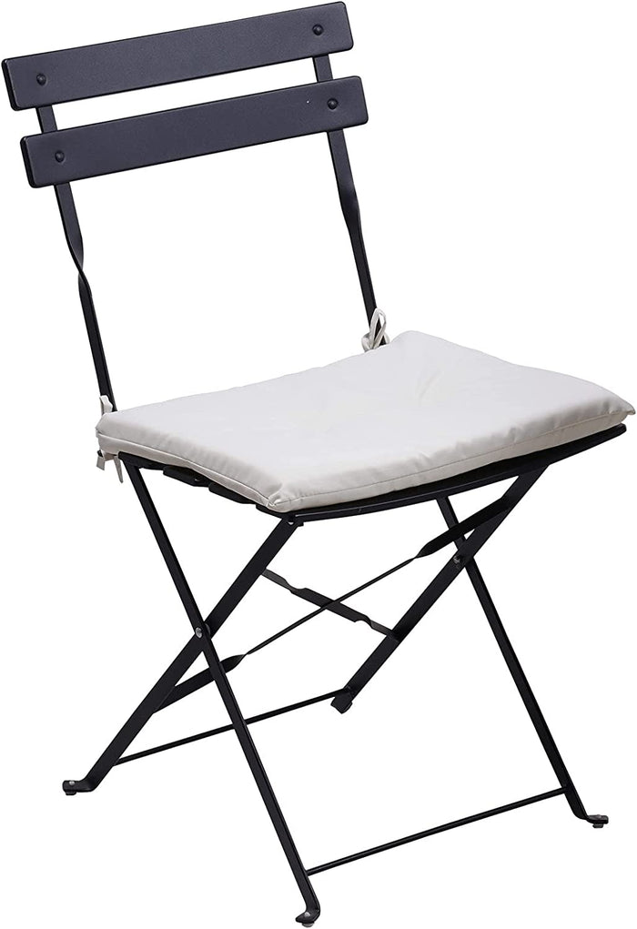 Black folding chair with a white cushion on a white background