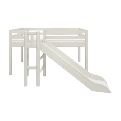 FLEXA loft bed from WHITE collection in solid pine with dividing safety rail, ladder and slide, shown in child’s bedroom.